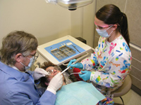 Harvest Hills Dentist performing surgery 